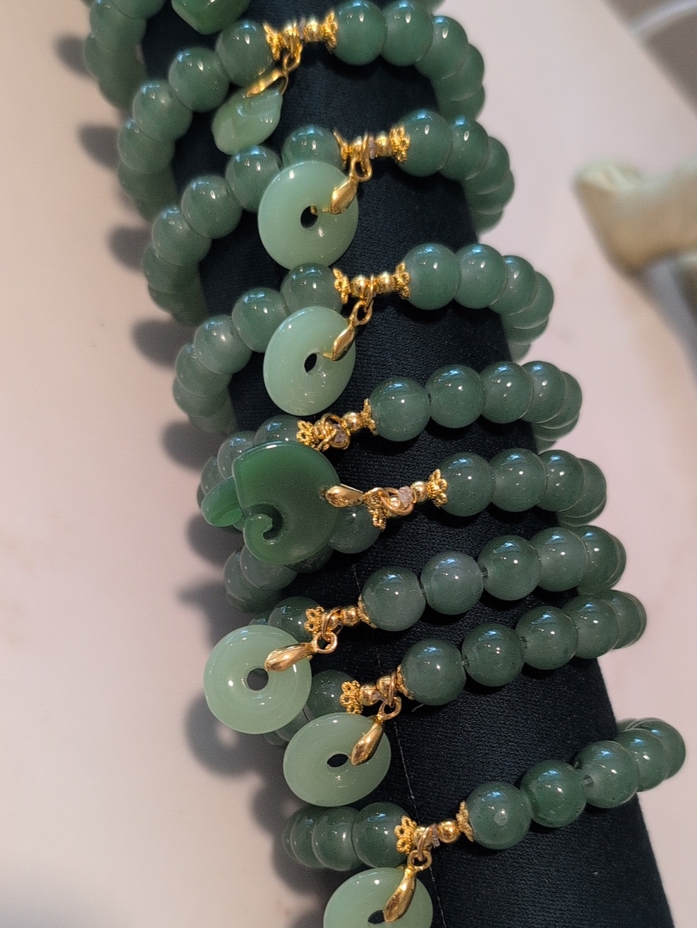 12 Jade Green Color Glass Beaded Bracelet with Gold Accents And Green Charms